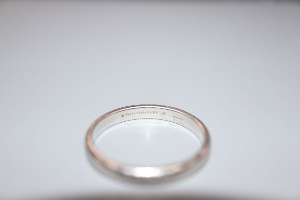 A Tiffany & Co platinum wedding band, size R/S, 5.8 grams.